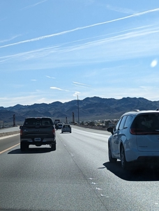 Cars drive down a highway