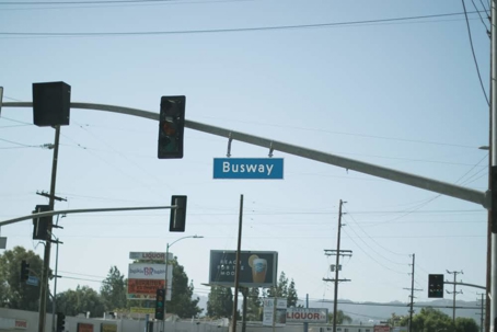 A streetscape shows a "Busway" sign