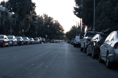 Street with cars parked along both sides