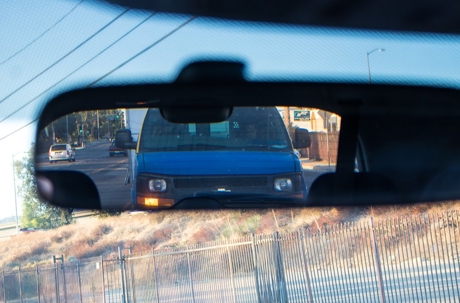 car reflecting on a mirror