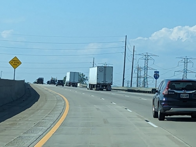 trucks travel on a highway