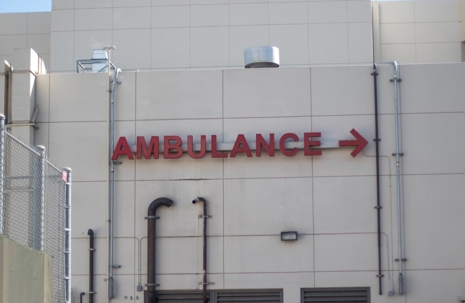 A red "AMBULANCE" sign