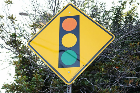 A yellow diamond traffic signal