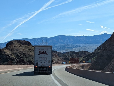 truck drives on a mountain highway